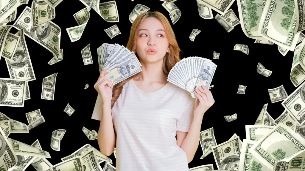 uma garota nova mostrando dinheiro e no fundo cheio de dinheiro caindo.