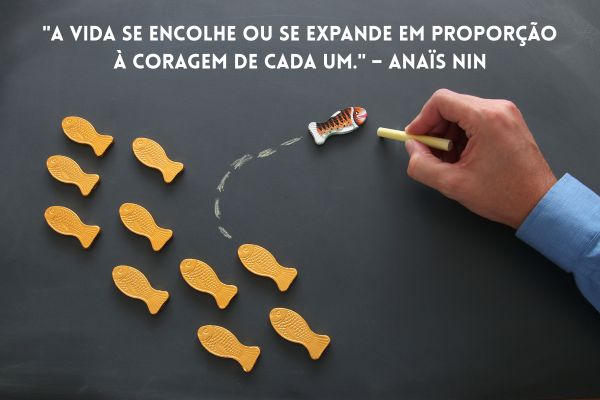 frases sobre vida uma mão , um quadro cinza com desenho de peixes juntos mas com um indo para o outro lado